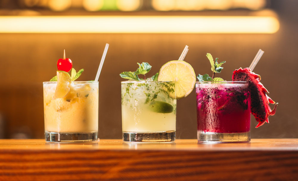 Three beautiful-cocktails lined up in an aesthetic way